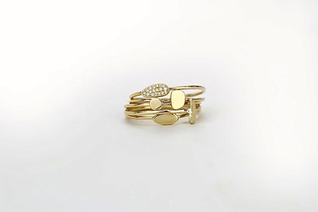 totem stacking rinks in 18 K yello gold by Marion Cage.jpg